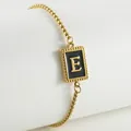 18K gold plated stainless steel bracelet featuring black enamel pendant with letter E - Letter E (ZH497H-E-02)