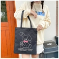 Japanese style black canvas tote bag with cartoon rabbit and wide strap on model - Black Style 4 (Cartoon Rabbit)