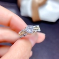 Macro view of two-tone layered ring featuring a brilliant round moissanite main stone - Adjustable Open / White Zirconia