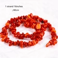 Close-up of a 16-inch strand featuring irregular polished red coral crystal beads - Red Jasper