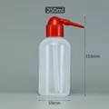 Detailed view of a 250ml white squeeze bottle with 153mm height and curved red nozzle - 250ml (Red Tip)