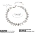 Detailed close-up of stainless steel pearl cluster bracelet with lobster clasp and chain - 17+5cm / Silver
