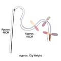 Interactive wand cat toy with white flexible spiral hose and purple wings on white background - Sequin Little Fly