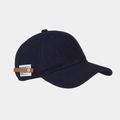 Detail view of navy blue baseball cap featuring side leather patch and metal rivet decoration - Navy Blue