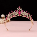 Close-up of golden Baroque crown with pink teardrop stones and sparkling crystals - No.1 KC Gold (Rose Red Stone)
