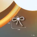 Ciondolo a fiocco in lega dorata con cristalli e perla, dimensione 23mm elegante - Stile Fiocco Traforato (172)