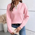 Detail of the elegant white lace V-neckline on a pink knitted long sleeve sweater - S / Pink