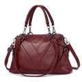 Deep burgundy tote bag with V-shaped quilting and dark gunmetal hardware accents - Burgundy