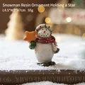 Figurine bonhomme de neige en résine avec écharpe à pois et étoile, hauteur 7 cm - Bonhomme de neige C - Tenant une étoile orange