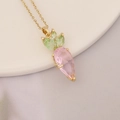 Close-up of carrot pendant necklace with pink teardrop and green crystals on 18k gold chain - Carrot Shape Pink Gem (15#)