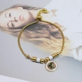 Elegant gold titanium steel clover bracelet with sparkling white cubic zirconia crystals - Four-Leaf Clover Style / Gold