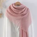 Solid pink cotton linen scarf with frayed edges hanging over a white shirt - Hot Pink