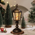 Close-up of vintage bronze Christmas lantern with warm LED light and Nativity scene - Nativity Scene