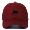 Detailed close-up of a burgundy baseball cap with a black cat embroidery and yellow eyes - Adjustable / Burgundy