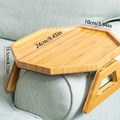 Bamboo sofa armrest tray with drink holder measurements 24cm by 10cm on a grey couch - Bamboo Wood / Rhombus / Natural
