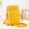 Detailed macro view of yellow multi-layer crossbody bag with butterfly embroidery - Yellow
