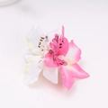 Detail of pink and white gradient orchid hair clip with realistic fabric petals - Off-white + Pink