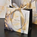 Elegant marble pattern gift bag with ribbon handles and Happy Times gold decorative print - White With Gold Accents (with Silver); Small Size 18*16*10cm