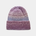 Close-up of chunky ribbed knit tie-dye beanie in purple and pink gradient tones - Purple