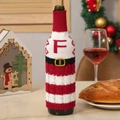 Knitted Christmas wine bottle cover with red and white stripes and letter F design - Letter F