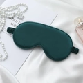 Dark green silk satin sleep mask on white fabric with elegant pearl accessories - Dark Green Eye Mask