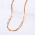 Elegant multi-layered rose gold stainless steel necklace on a clean white background - Rose Gold Necklace