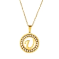 Close-up of gold V letter circular pendant with crystal stones on a thin O-chain - Letter U