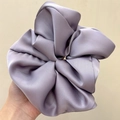 Oversized light purple satin scrunchie held in hand showing smooth silk-like texture - Oversized / Purple (Satin)