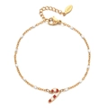 Detail of Christmas candy cane pendant on stainless steel gold bead bracelet - White