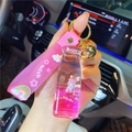 Pink unicorn liquid quicksand keychain with milk tea cup design and wish silicone strap - Pink-Champagne Bottle Unicorn