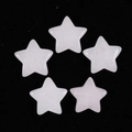 Detailed view of five polished star-shaped crystals in natural semi-precious quartz stones - White Crystal