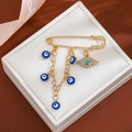 Gold safety pin brooch with blue evil eye beads and crystal tassel pendants - Evil Eye Rhinestone Style (Z71)