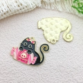 Enamel black cat charm with pink Halloween gift box and golden textured back detail - 29x23mm