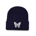 Navy blue knit beanie with white butterfly embroidery and vertical ribbed texture - One Size / Navy Blue