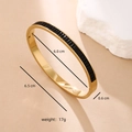 Detail of gold titanium steel bangle showing dimensions 6.5cm with black inlay stones - Black Zirconia - Gold Plated