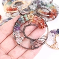 Close-up of handmade tree of life pendant with colorful chakra natural crystal stones - Antique Bronze Round Curved Tree of Life Pendant