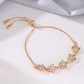 Bracciale regolabile in oro con fiori di cristallo e pietre lucenti su seta elegante - Forma di Fiore / Oro