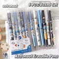 Detailed close-up of 0.5mm erasable gel pens with astronaut patterns on notebook - Astronaut Theme 6Pcs/Box-Crystal Blue Ink