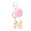 Letter N resin keychain with pink pompom and colorful heart sequins inside - Letter N