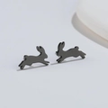 Detail shot of running rabbit stud earrings in matte black minimalist metal finish - 485 Running Rabbit (Black) / 485 Black