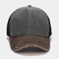 Detail of distressed brim and breathable mesh on vintage washed trucker baseball cap - Army Green and Brown