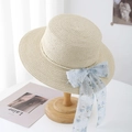 Straw cloche hat with white pearl trim and light blue floral bow on a wooden stand - One Size / Beige Pearl Floral Mesh