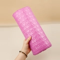Detailed view of pink heart-quilted PU leather manicure arm rest with glossy finish - Semicircle Heart Nail Pillow Rose Red
