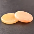 Polished round 40mm quartz crystal discs in soft pink and yellow with oily luster - Topaz