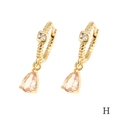 Detailed macro view of 18K gold-plated earring with pink teardrop crystal and square stone - Champagne Teardrop (ER1138)