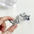 Pair of mini butterfly hair claws in translucent grey resin with gold metal spring - 77 Small Gray (1pc)