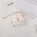 Cute bunny seersucker drawstring bag in cream white with heart and bow patterns - Blue Dress Rabbit
