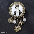 Vintage gold brooch with female portrait enamel, pearls, and charm pendants 3.6x7cm - Vintage Figure Tassel