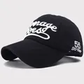 Detailed close-up of 55 Striker embroidery on black cotton twill baseball cap - AVERAGE JOES Style / Black