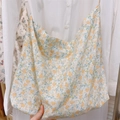 Detailed macro view of yellow floral pattern and soft cotton fabric of the tote bag - Light Yellow Floral
